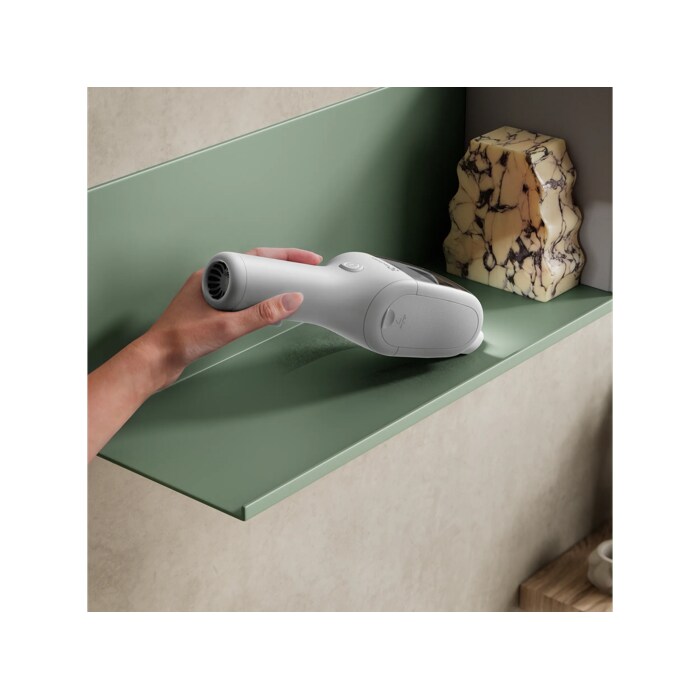 Product vacuuming fine dust on a shelf