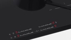 A close up of induction hob controls