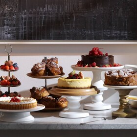 A table filled with cakes at the Bake For Someone pop up bakery
